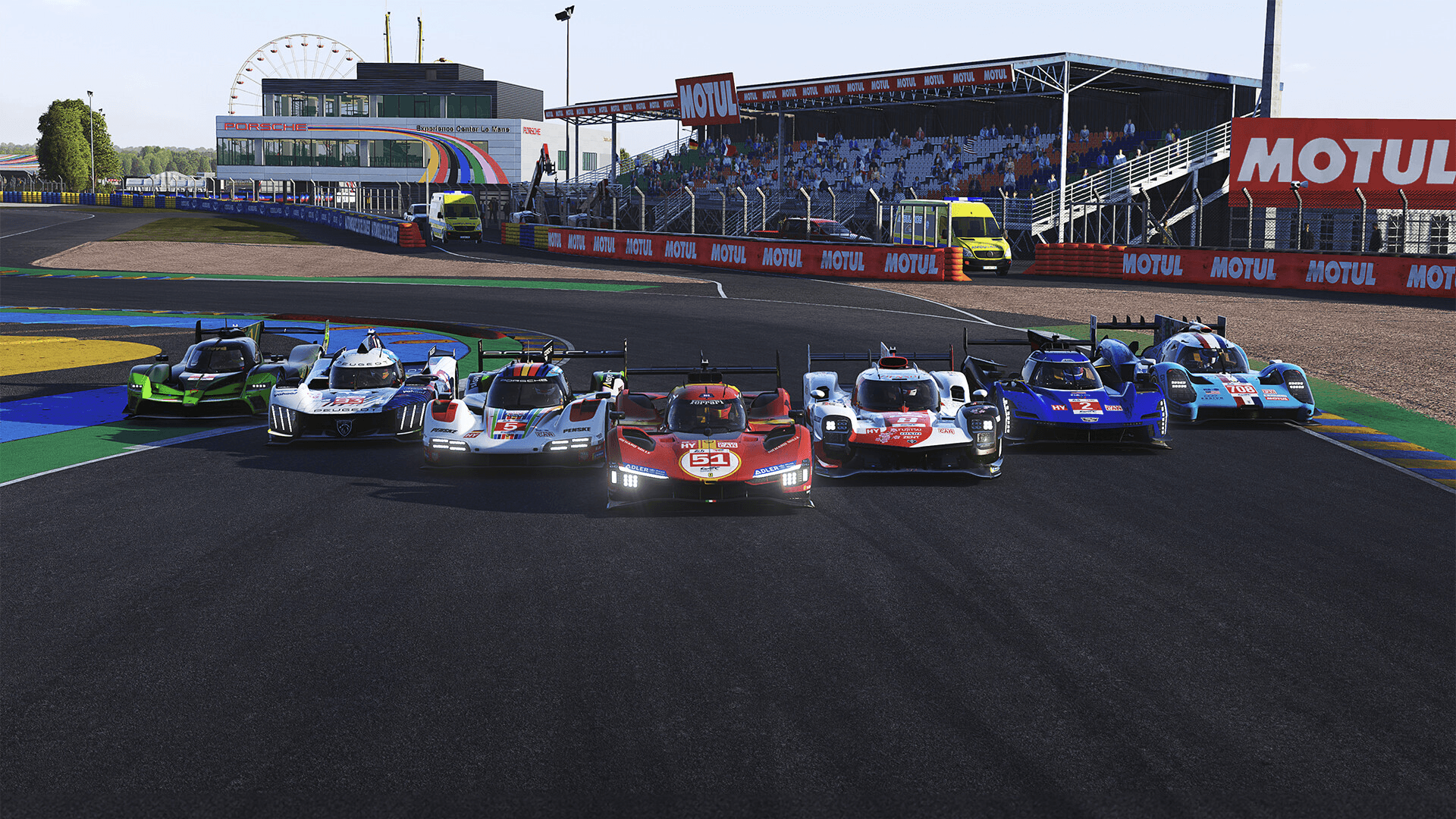 le mans utimate prototype cars lined up on a track
